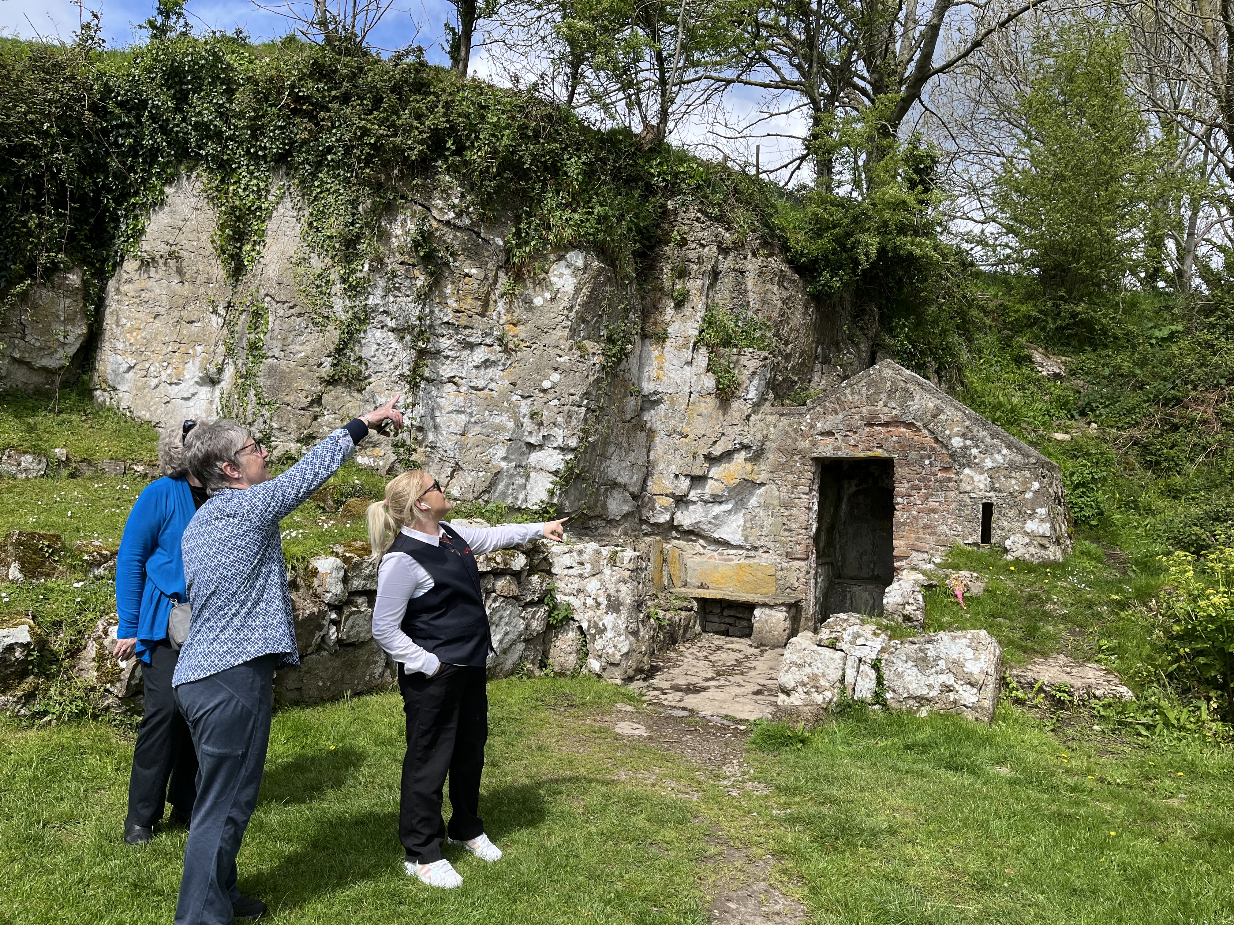Group looking at holy well Penmon