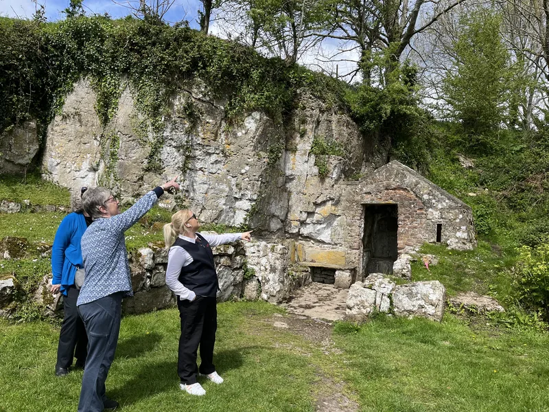 Group looking at holy well Penmon